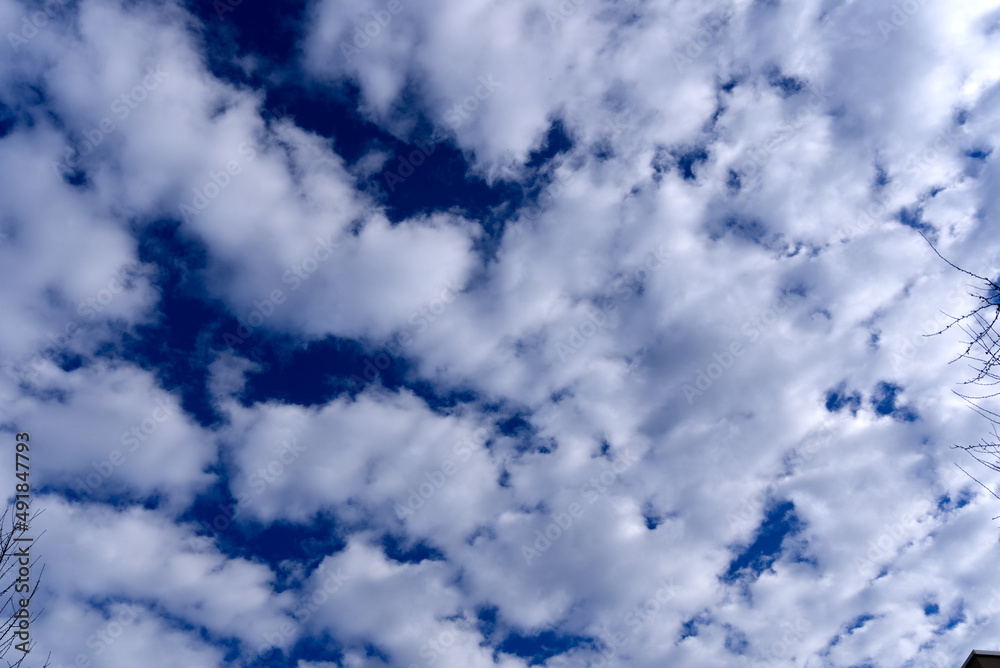 Puffy clouds up in the sky at City of Zürich on a cloudy winter day. Photo taken February 18th, 2022