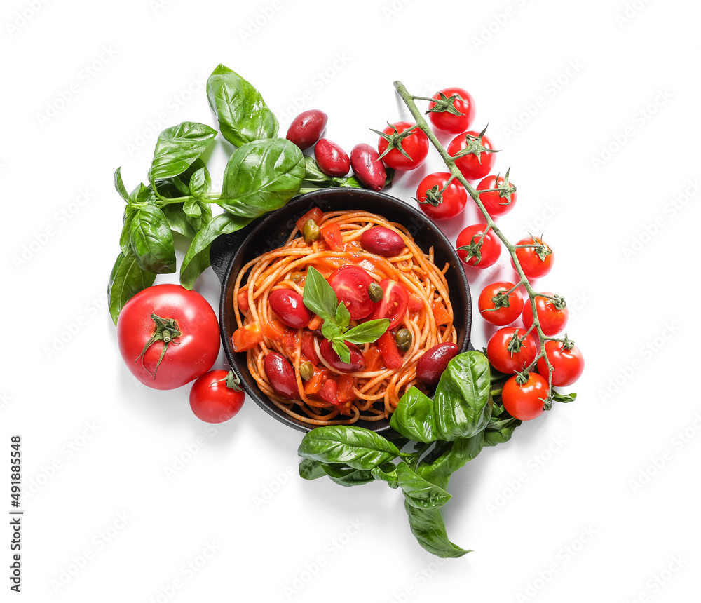 Frying pan with delicious Pasta Puttanesca and ingredients on white background