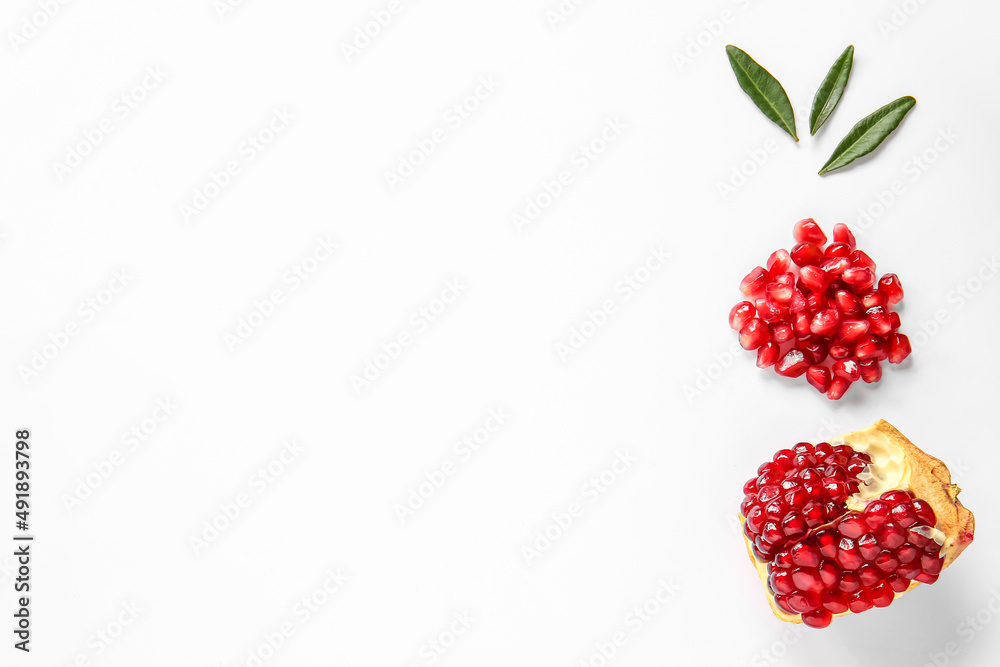 Tasty ripe pomegranate piece on white background