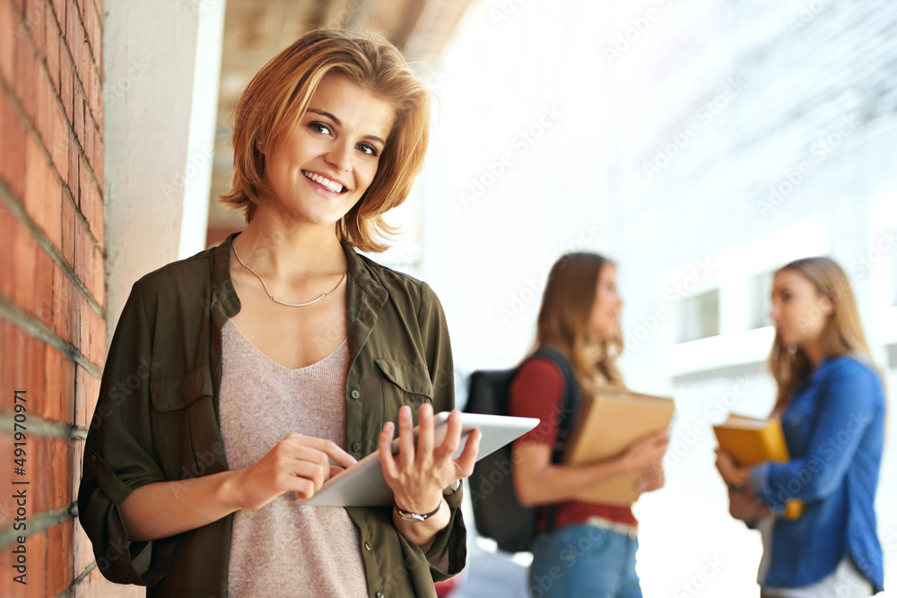 Technology is helping me excel at college. Portrait of a smiling female university student standing 