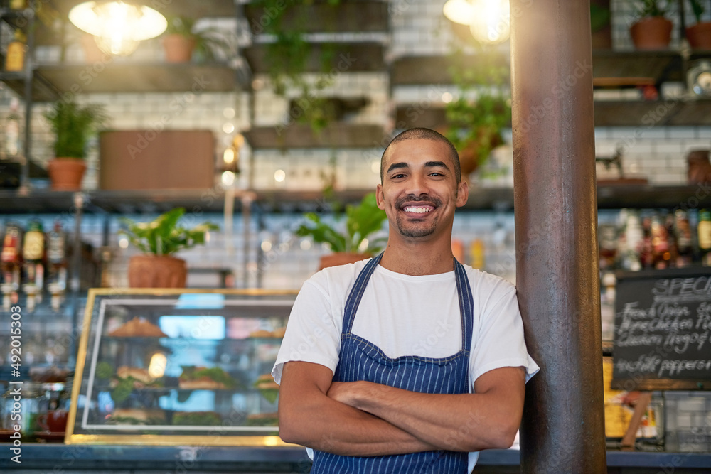 Customers always stop by for some quality service. Portrait of a young entrepreneur standing in his 