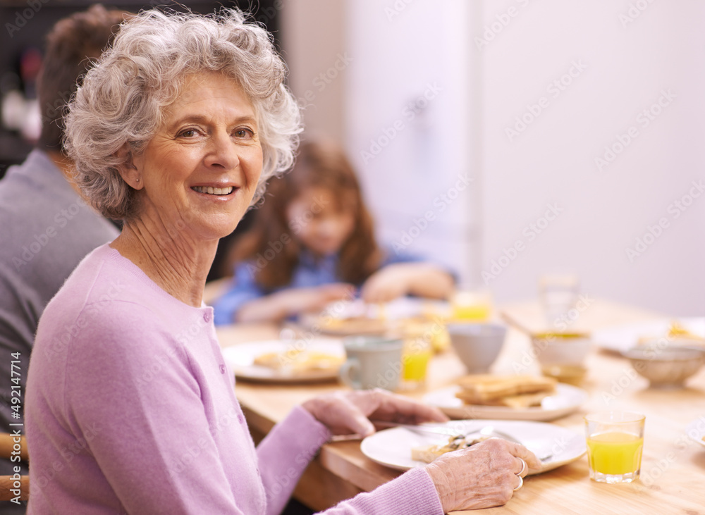 The best way to start a day. Cropped portrait of a senior woman enjoying breakfast with her family.