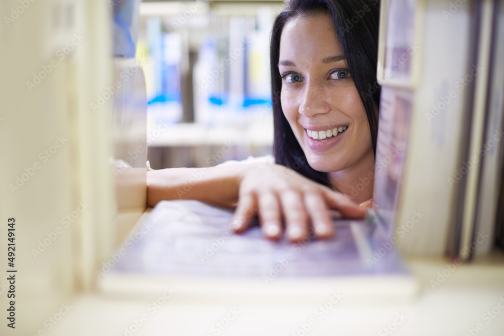 She got the last copy.... Portrait of a young female college student in a library.