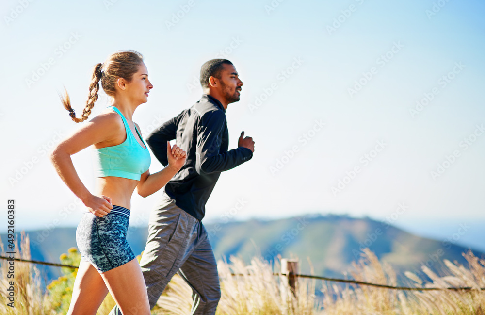 Its all about endurance. Cropped shot of a sporty young couple out for a run together.