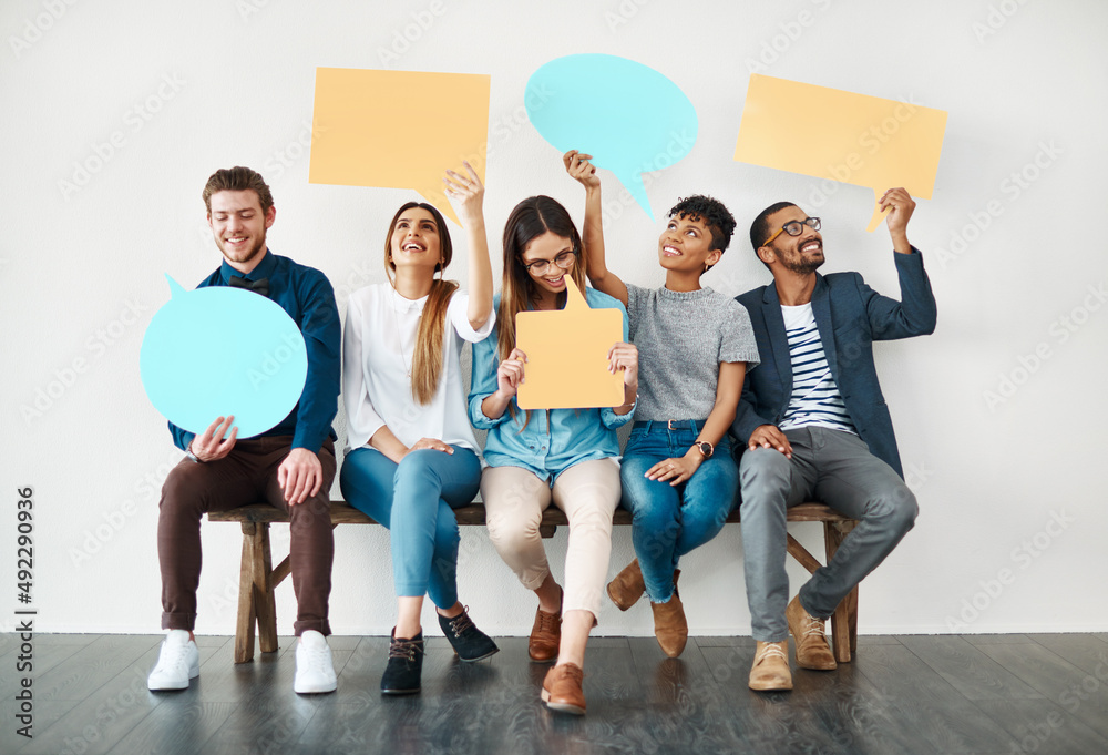 They are quite outspoken. Shot of a diverse group of creative employees holding up speech bubbles in