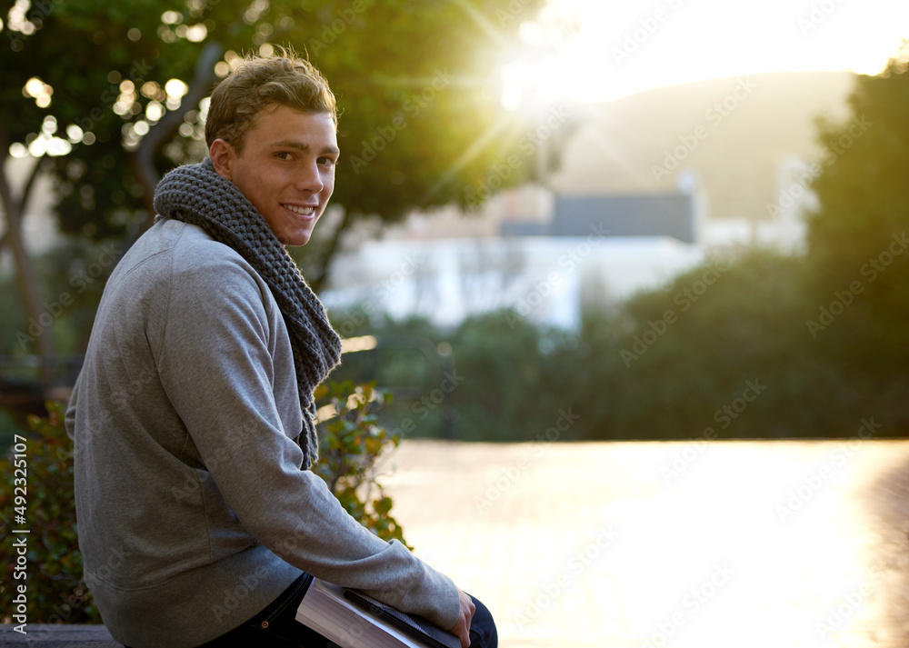 Waiting for my friends. Cropped portrait of a young man on campus.