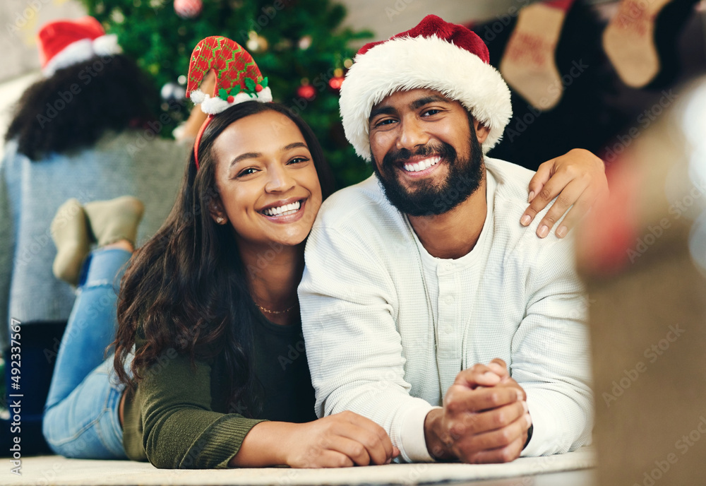 What a treasure to spend this time together. Portrait of a happy young family celebrating Christmas 