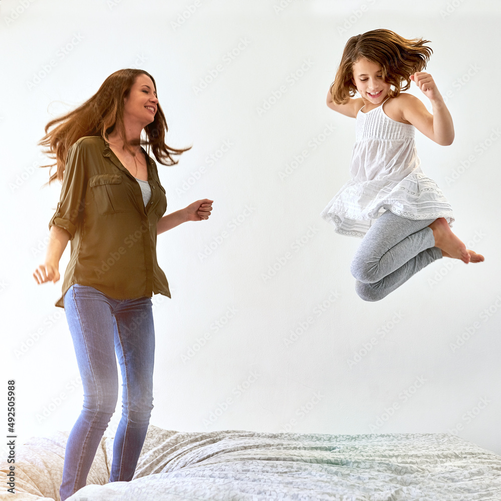 Priorities. Shot of a young mother and her daughter at home.