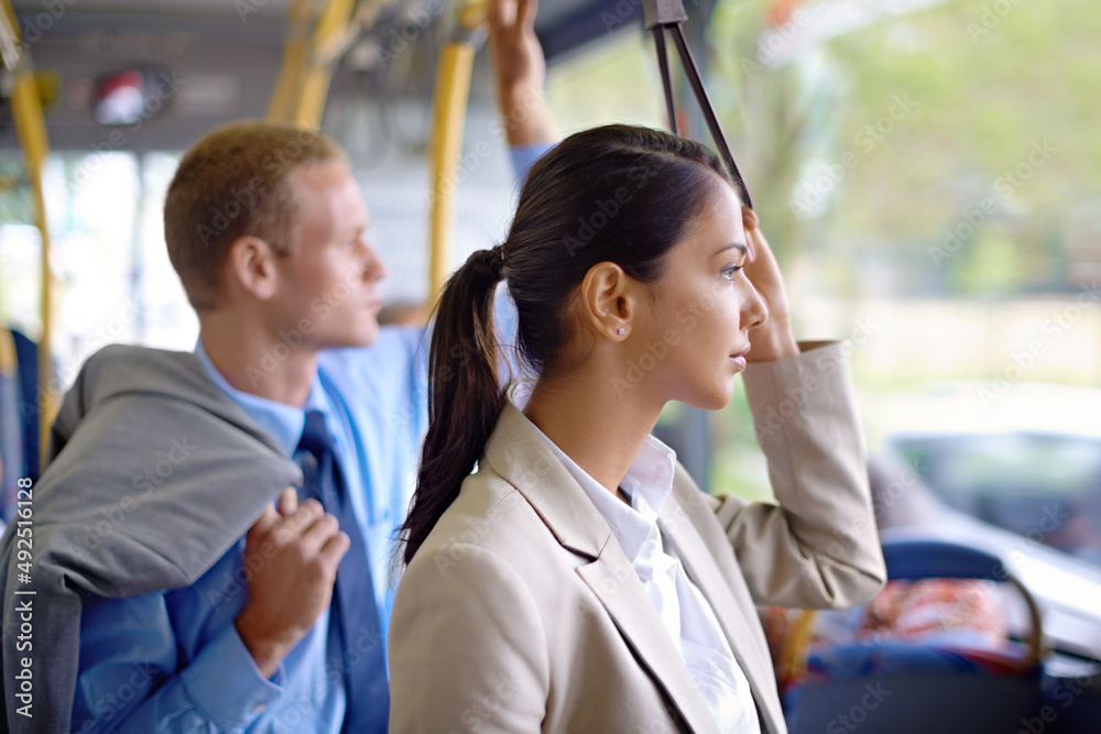 This is their daily commute to work. Shot of young business people commuting to work.