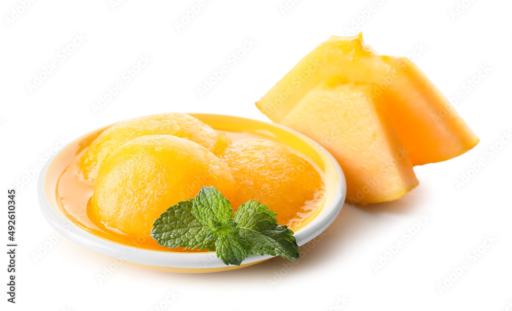 Plate with tasty sorbet and melon pieces on white background