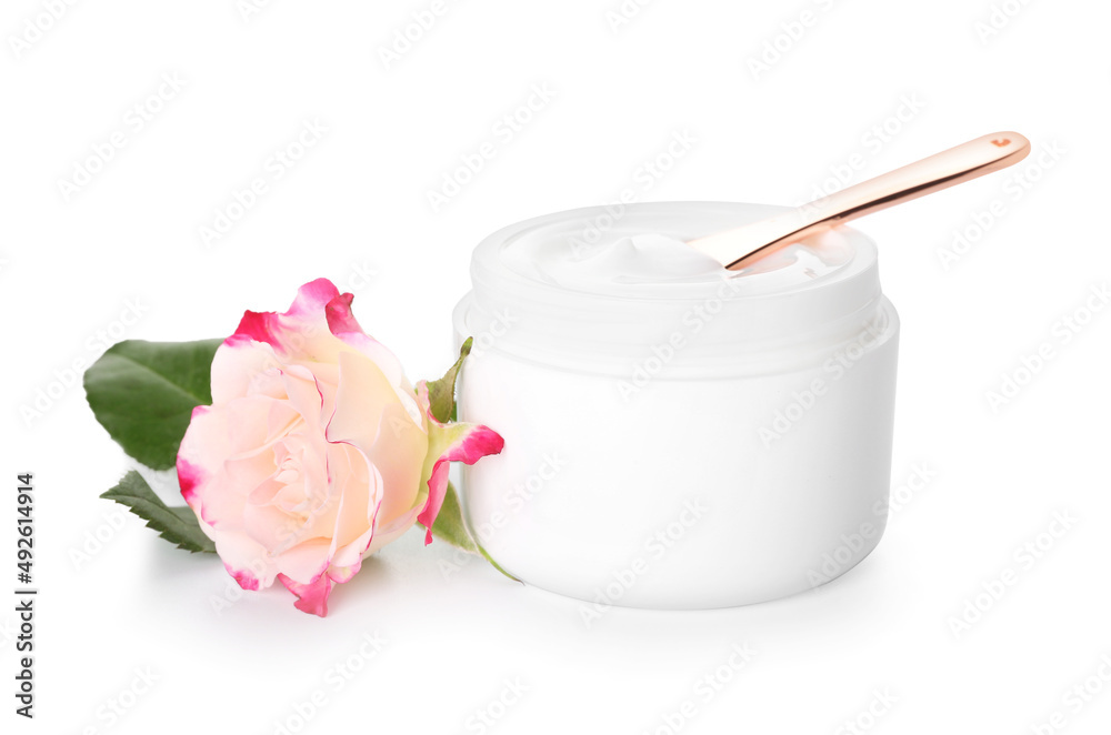 Jar with natural cosmetic cream and rose flower isolated on white background