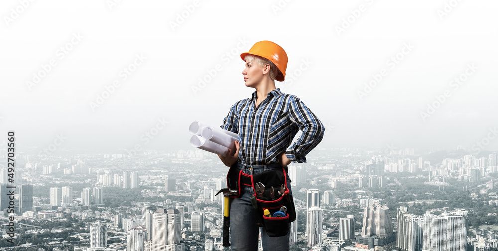 Attractive female engineer in hardhat