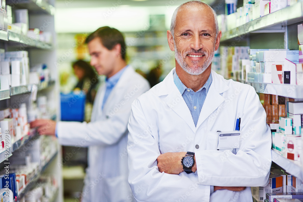 Your wellness is my main priority. Portrait of a confident mature pharmacist working in a pharmacy.