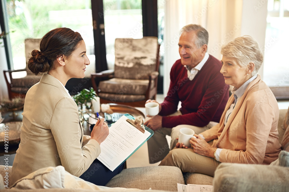 Its time to cash in our pension. Shot of a senior couple getting advice from their financial consult