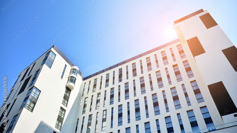 Modern office building in the city with windows and  steel and aluminum panels wall.