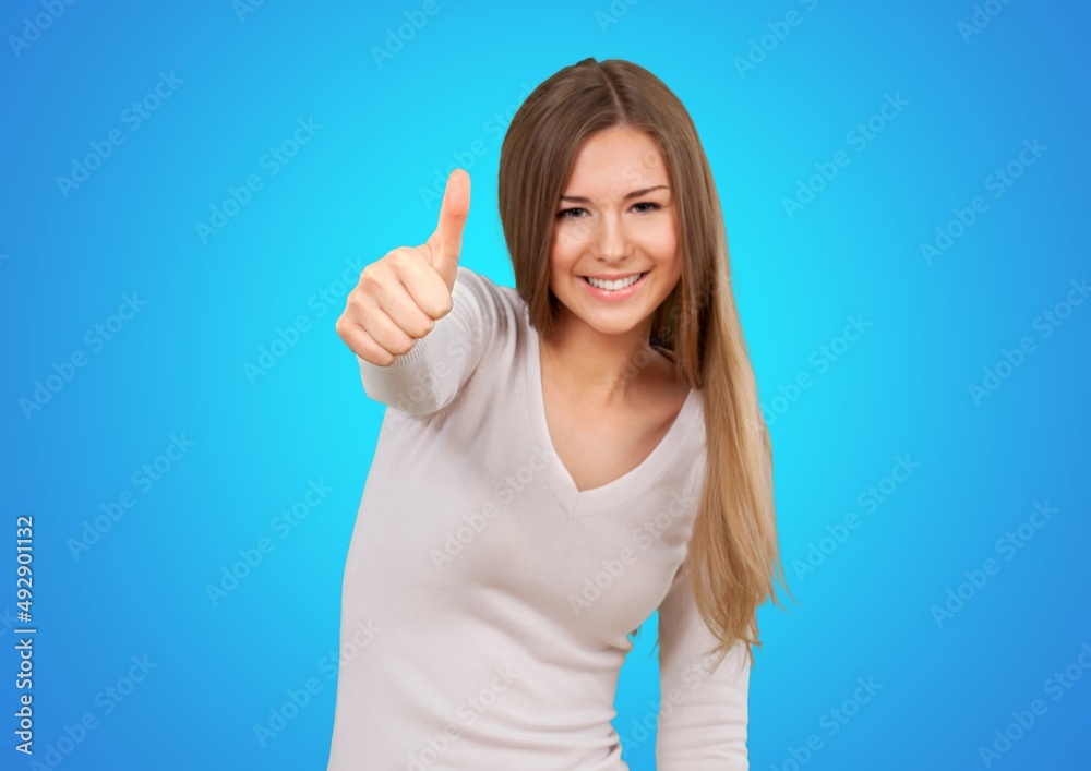 Hey you got point. Cheerful cute lively girl pointing camera thumbs up