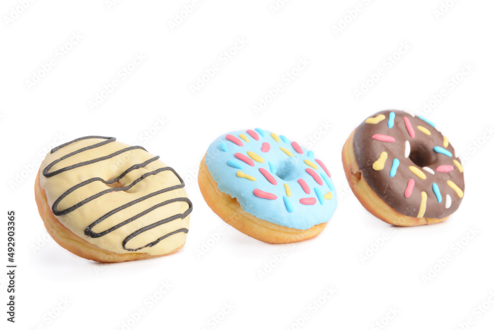 Different sweet donuts on white background