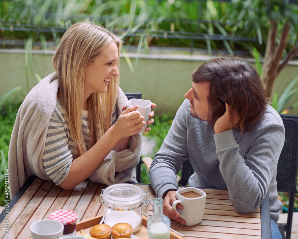 Love is friendship on fire. A happy young couple having coffee together in the morning.