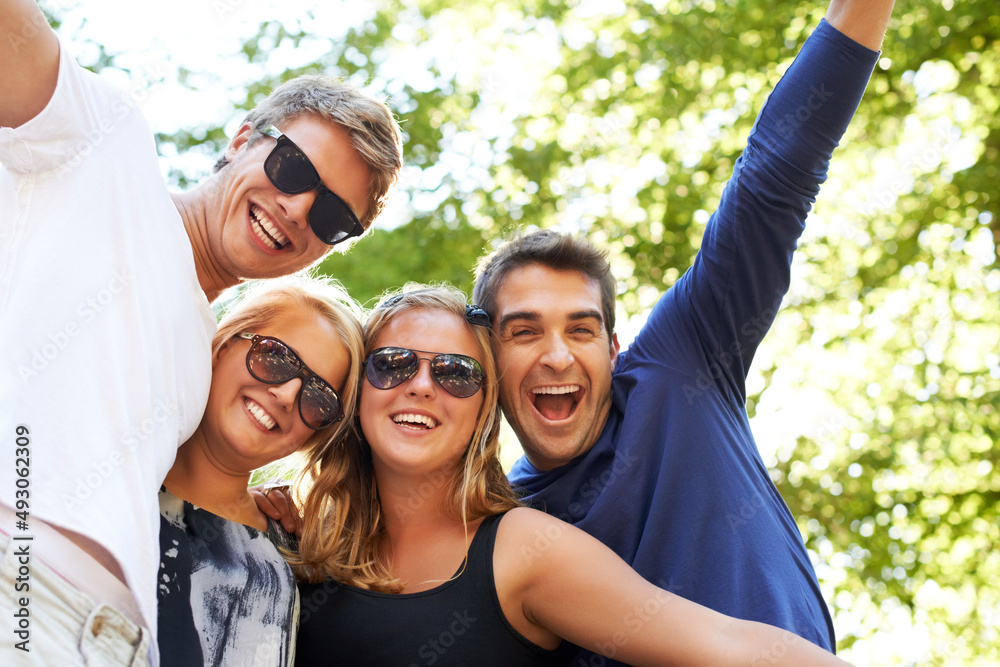 Outdoor festivities. Four friends partying and celebrating at a music festival.