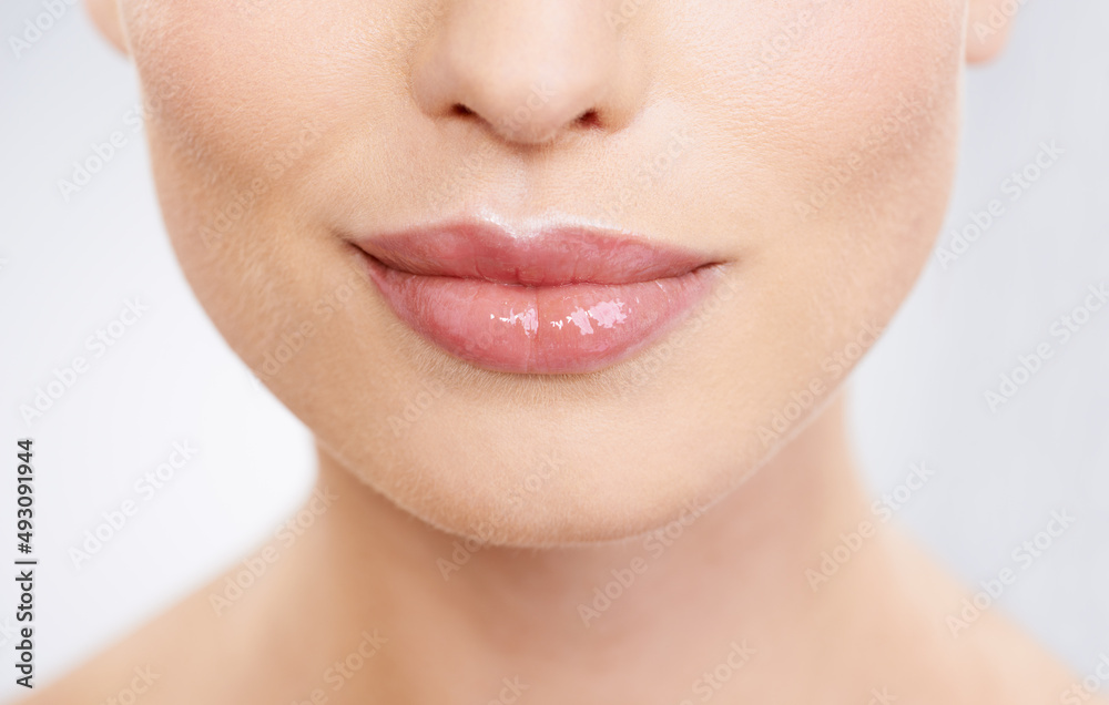 Lip stick shades for every mood. Closeup studio shot of models mouth.