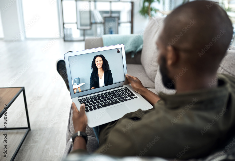 Working from home is here to stay. Shot of a young businessman having a video call with his colleagu