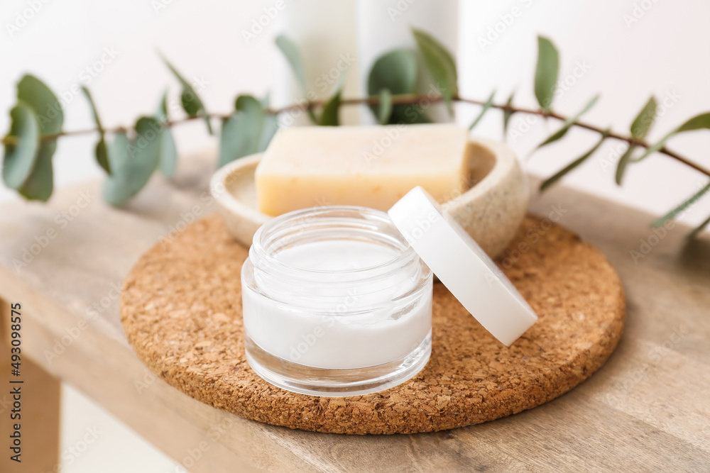 Jar of cosmetic product on wooden table, closeup