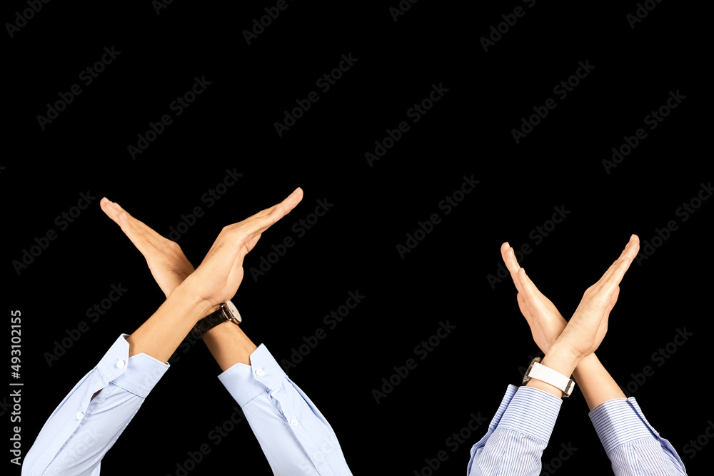 Business people showing stop gesture on black background