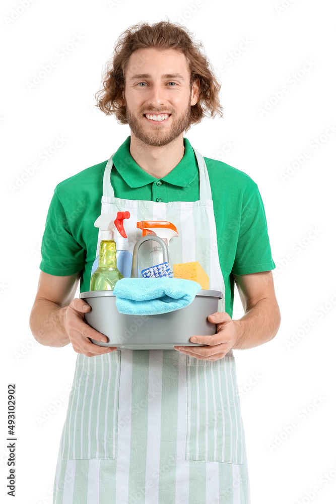 Young worker of cleaning service with supplies on white background