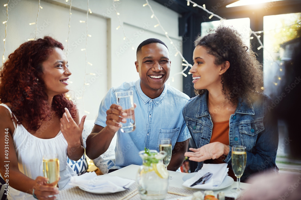 We always have a good time together. Cropped shot of a group of young friends enjoying a night out.