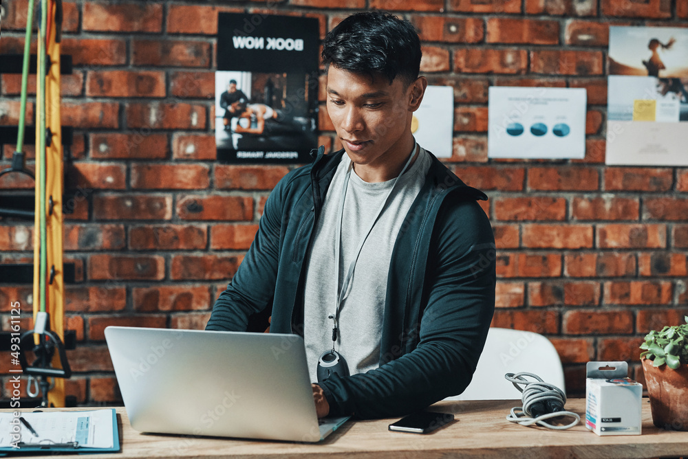 Hes receiving even more subscriptions online. Cropped shot of a handsome young male fitness instruct