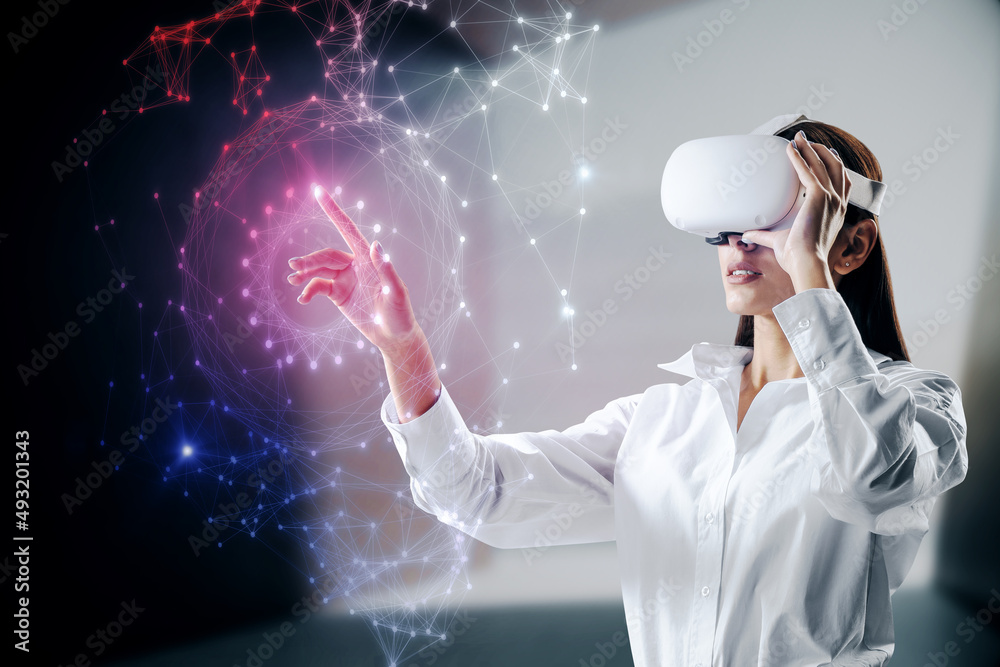 Attractive young european female with VR glasses using abstract polygonal sphere on blurry office in