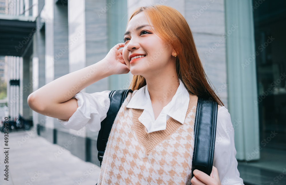 Young Asian woman going to work