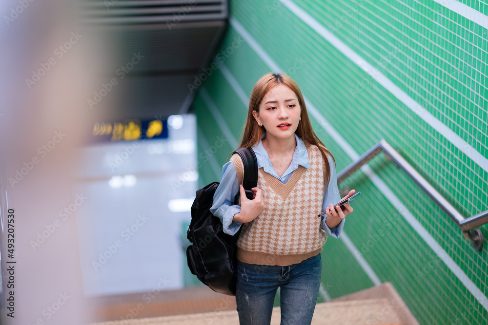 Young Asian business woman going to work