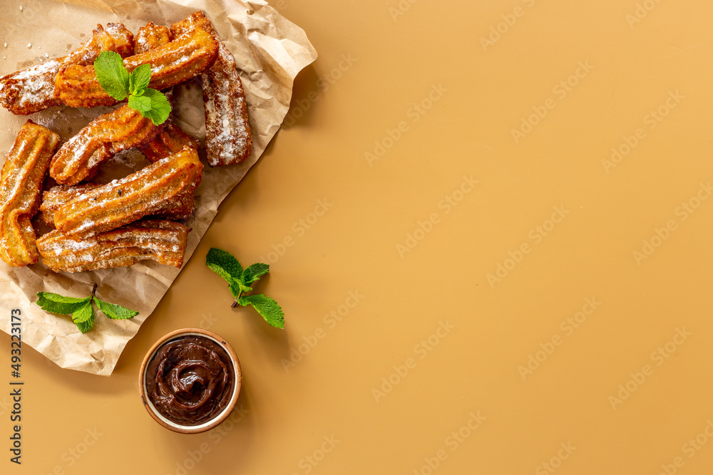 Spanish churros waffles with chocolate and sugar