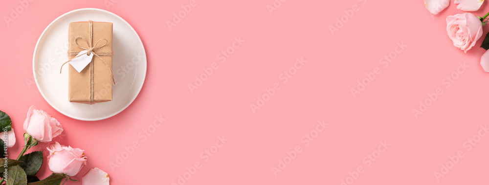 Mothers Day sending gift and meal design concept background with pink rose flower on pink backgroun