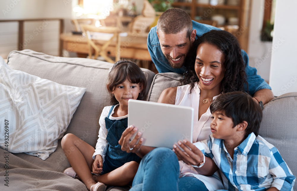 We found some online entertainment for the whole family. Shot of a family of four watching something