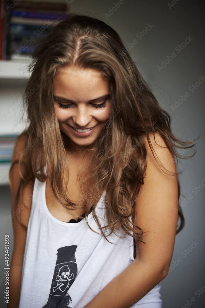 Filled with fun and happiness. A beautful young woman having a laugh.