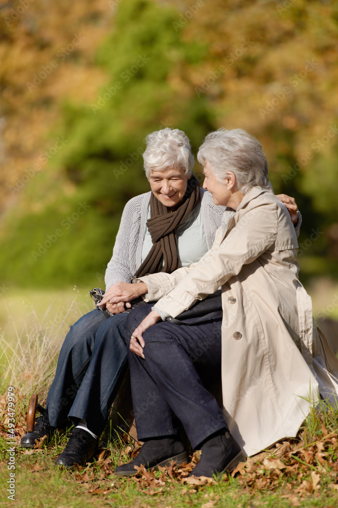 Enjoying an afternoon outdoors. Happy senior women spending time together outdoors.