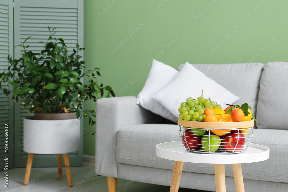 Fruit basket on table in stylish living room