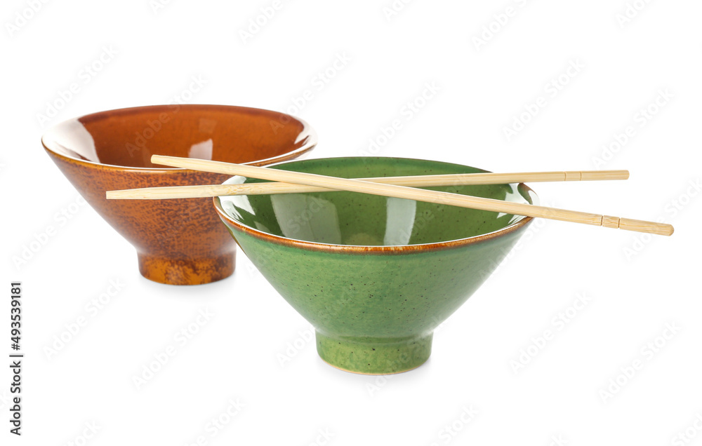 Chinese bowls with chopsticks on white background