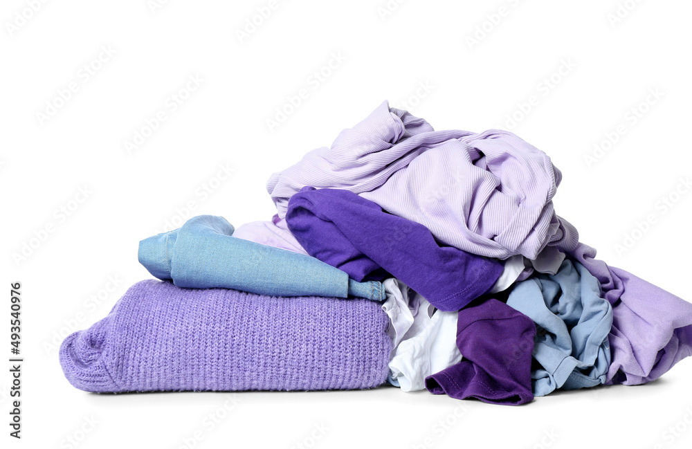 Different crumpled clothes on white background