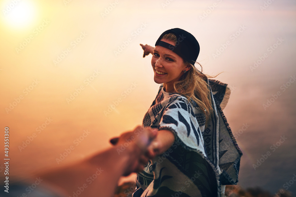 Lets go see whats over there. Portrait of a happy young hiker pointing out a foggy view while holing