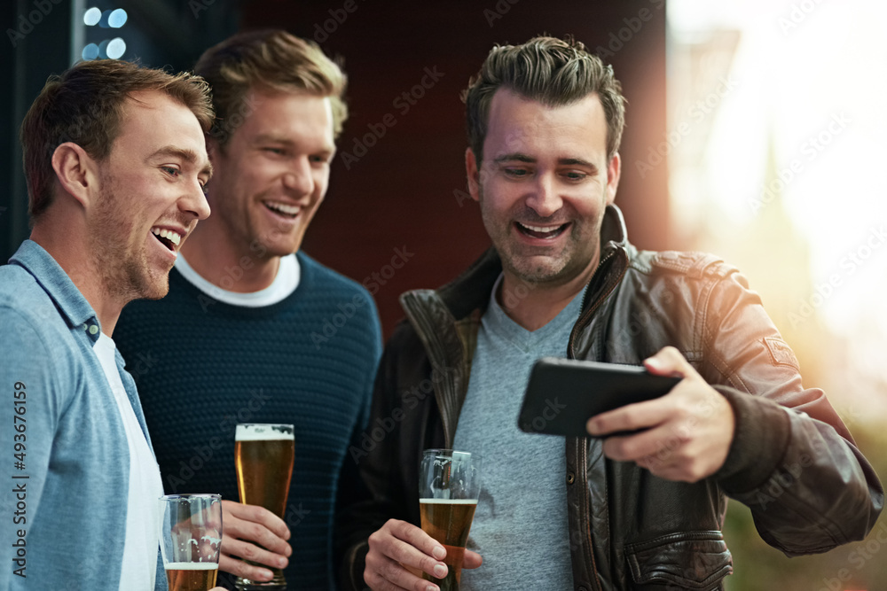 Check out this video. Shot of a group of friends enjoying a beer together while standing on a balcon