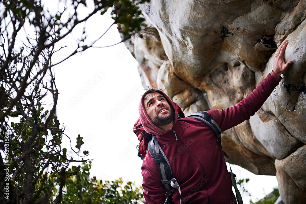 Making some headway. Shot of a young man enjoying a hike through the mountains.