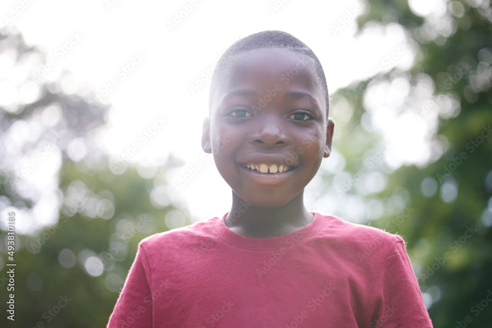 Playing outside is my favourite. Shot of a young boy relaxing outside.