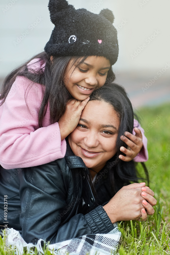 She loves to play with mommys hair. Cropped shot of a little girl playing with her mothers hair outs