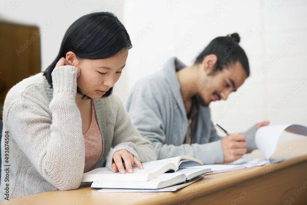 This test could change their lives for the worse or for the better.... Image of two students sitting