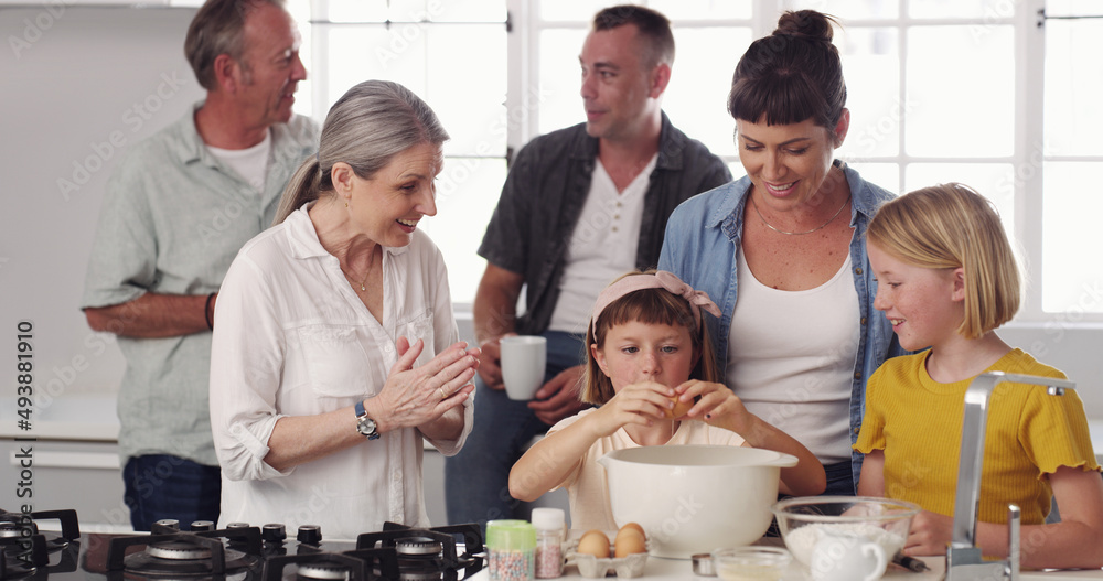 Were going to bake a cake. Shot of a family baking together in the kitchen.