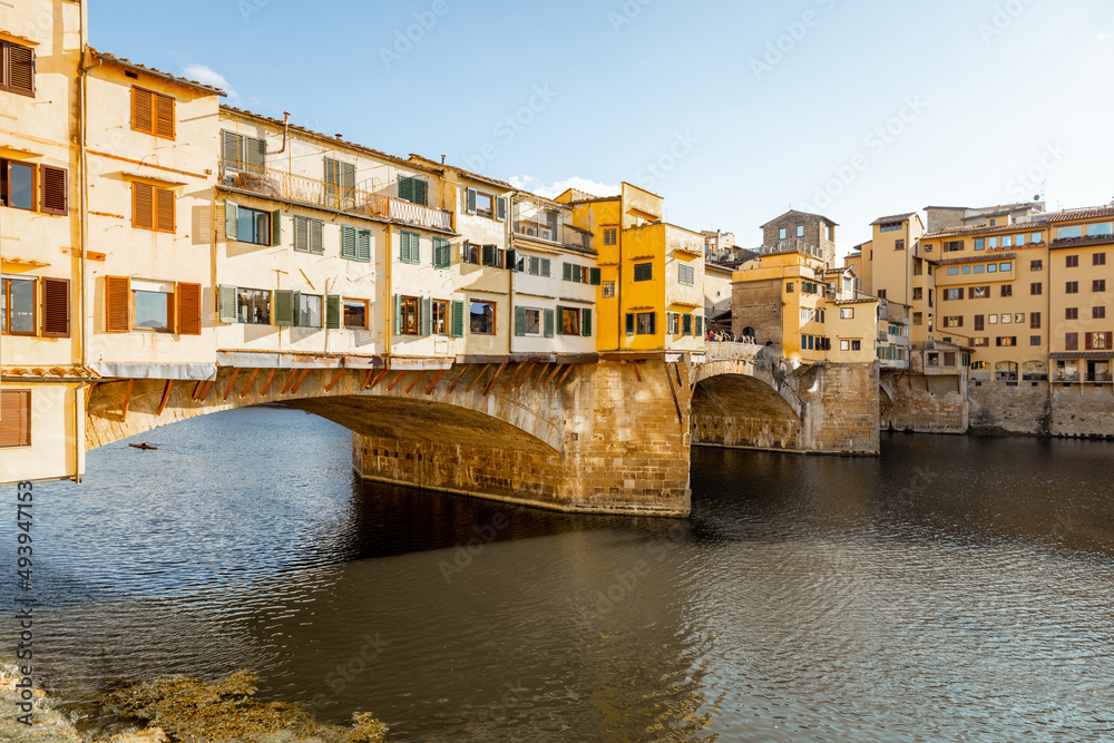 Sunset view on famous Old bridge called Ponte Vecchio on Arno river in Florence, Italy. Concept of t