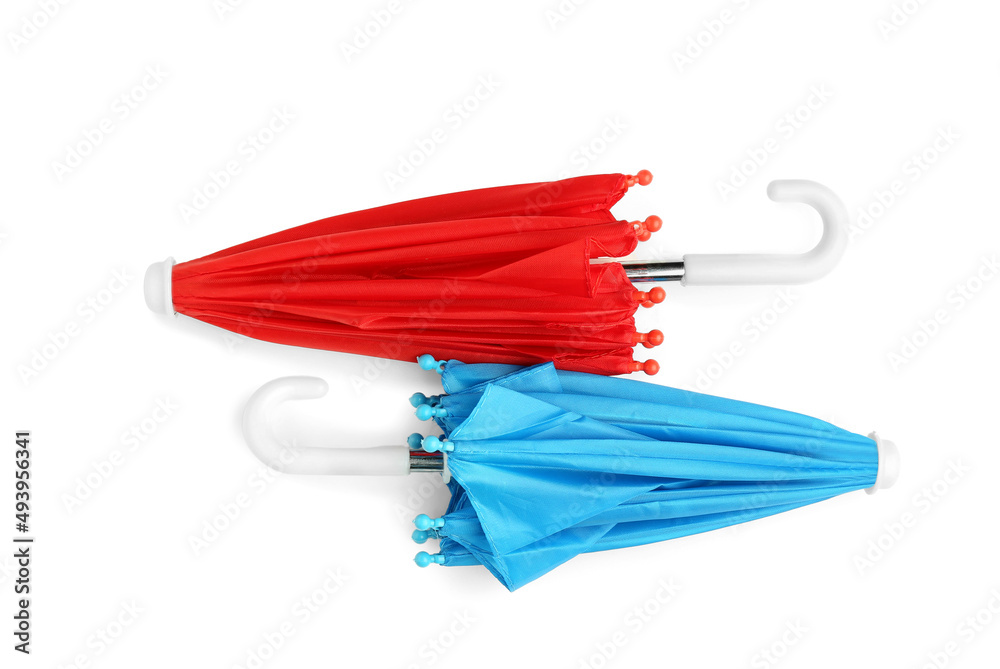 Two umbrellas on white background